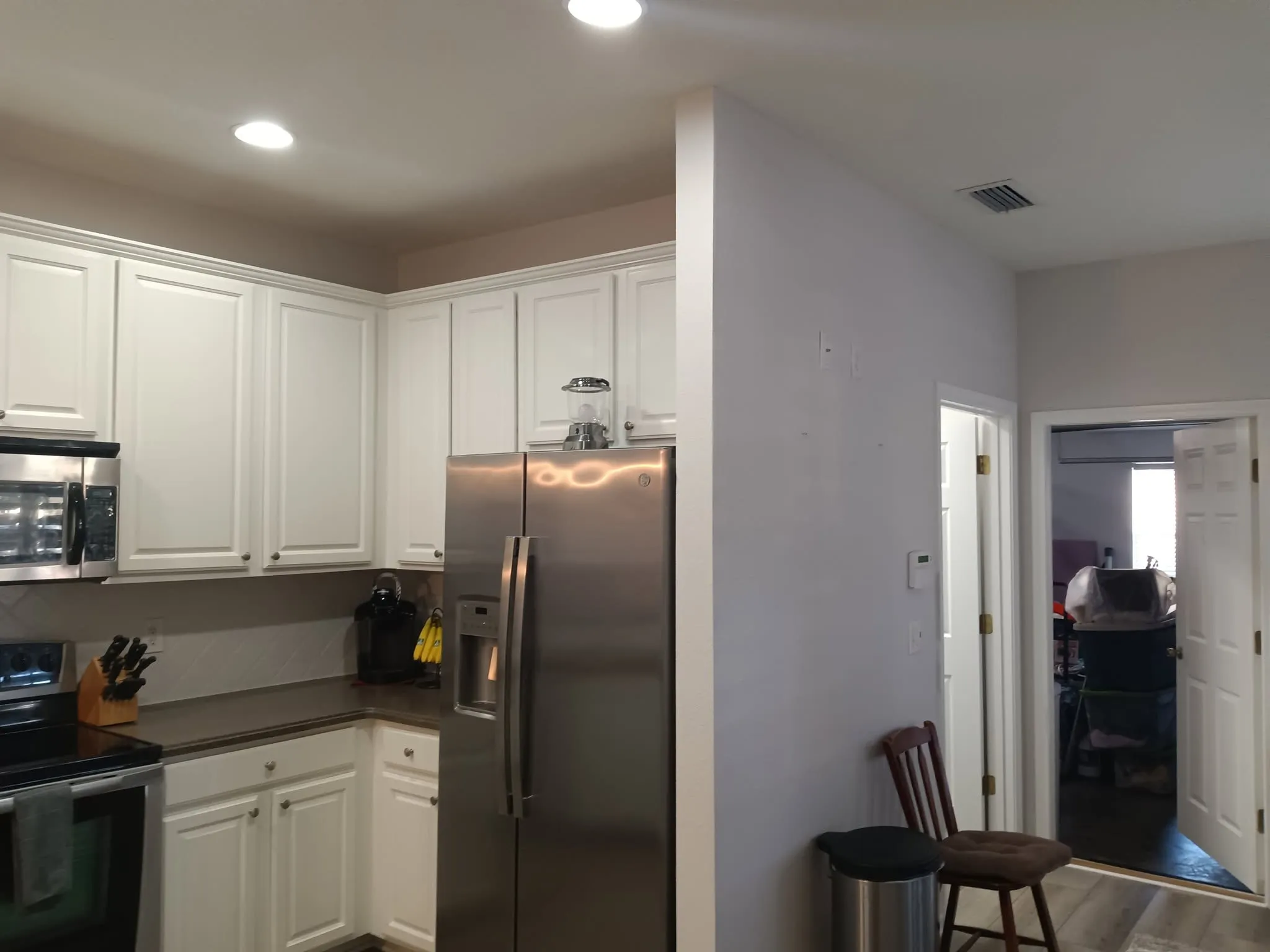 Freshly repainted kitchen with white cabinets