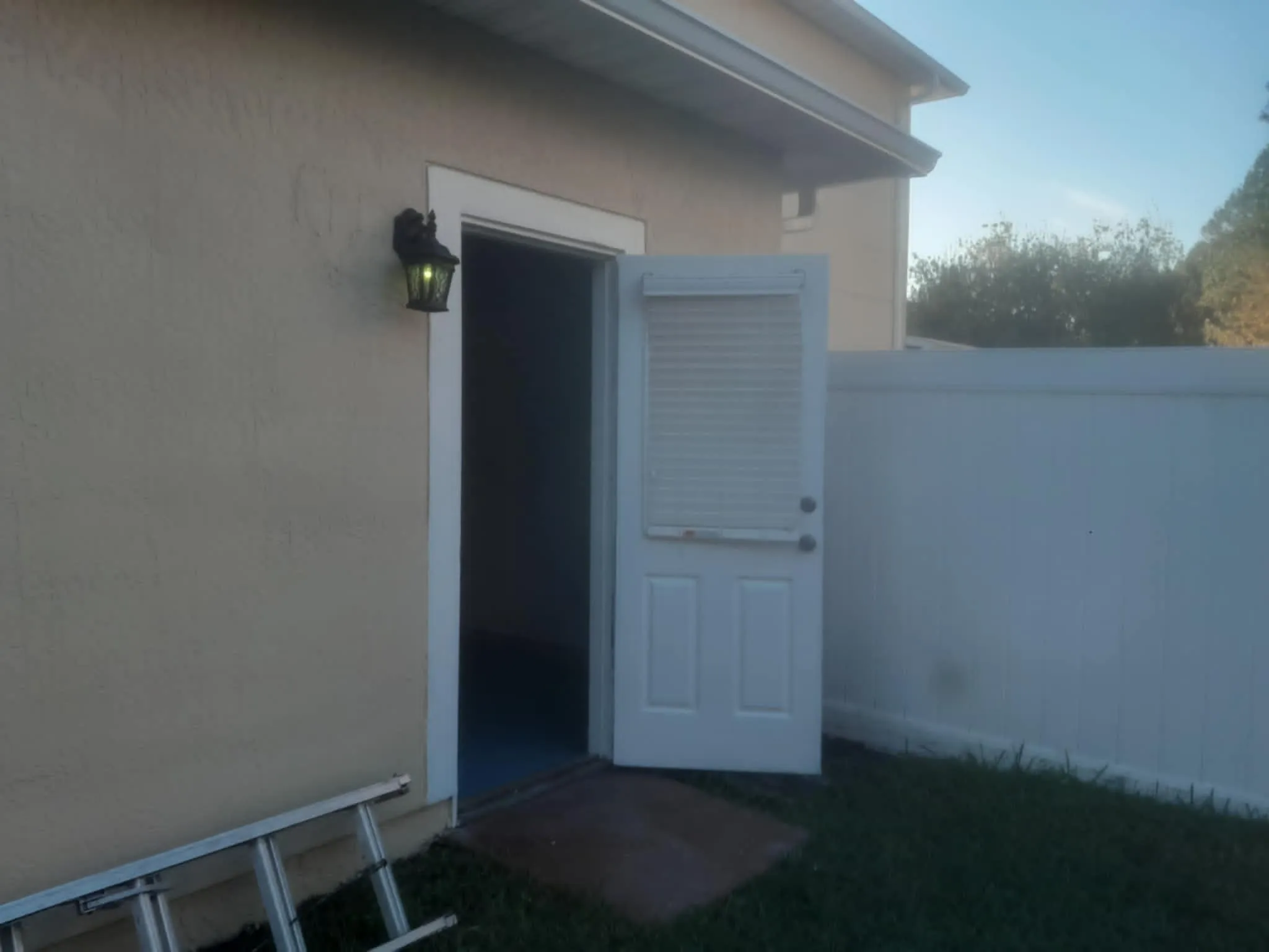 Side door and stucco, freshly painted